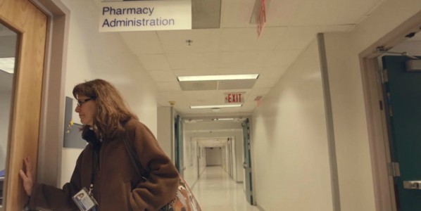woman walking into hospital pharmacy