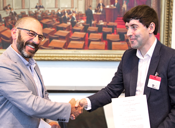 USP CEO Dr. Ronald T. Piervincenzi and BP’s group manager James Pound shake hands after signing an MOU to formalize the long-standing partnership between the two pharmacopeias.