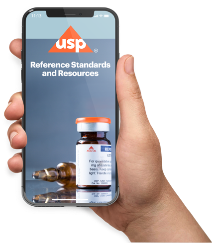Hand holding a mobile phone using the USP Reference Standards Mobile App