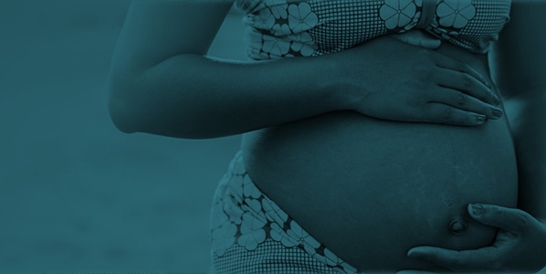 Pregnant woman holding her stomach